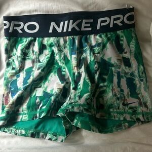 Green graphic nike pros